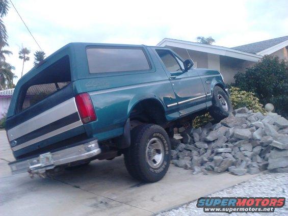 p82a0148.jpg there's a bunch of busted up concrete in my parking spot. what do you think im going to do? I love how my truck flexes better then a jeep