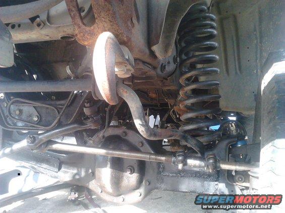 p82a02561.jpg another look of the driver side suspension

still need the bumpstops, aftermarket coilbuckets, F-250 shock tower, limiting straps, and some other stuff to be done.