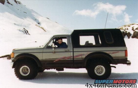 1994fordf15087.jpg This picture is taken in 1994 and shows the first modifications. A body lift of 2 in. and Bushwacker fender flares to make room for the 38 in. Radial Mudders on 15x14 whitespoke wheels. A custom built cap open to the front and with a bench seating for two. The only electronics was a CB radio.
