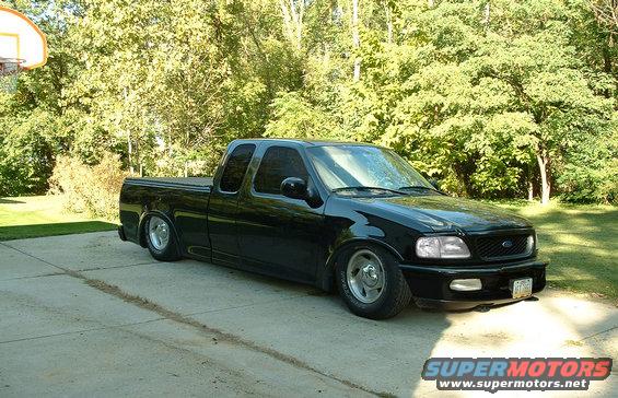 truckdone2.jpg my dads truck, lowered, shaved handles, shaved emblems, removed the 4x4 sticker, clear lenses, tinted windows, removed the running boards, killed the chrome, removed side moldings