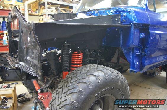 dsc08794.jpg Inner fenders going back on Had them powder coated semi flat black along with the core support