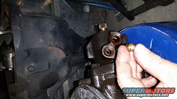 20171222_192115.jpg The 4-bolt steering gear I got from the Junk Yard had O-ring type fittings on both the pressure line and the return line.  I modified my return line to use the O-ring type fitting.  After everything was already assembled in the truck, I found this little gem.  What I'm holding in my hand is an insert that &quot;apparently&quot; adapts the steering gear to accept a flare-type fitting.  This adapter is installed in the hole where the flare fitting would normally screw into, and can be a PITA to remove, but I'd be willing to bet that these could be used in the 4-bolt steering gear so that one could use all the stock power steering hoses.