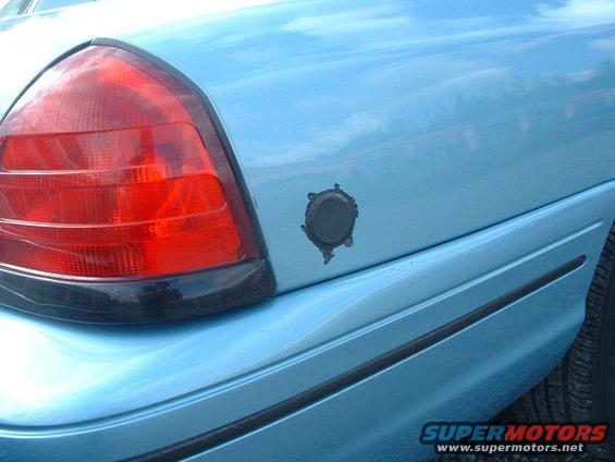 auction16.jpg Hole in the rear panel pluged where a spare key used to be put. All Seattle police vehicles have this.