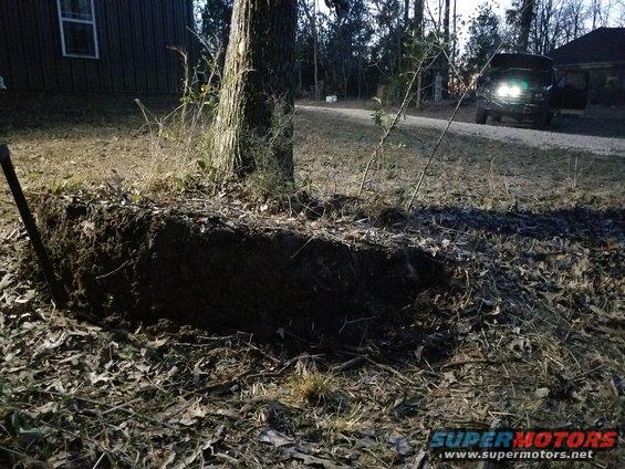 shopstump52.jpg I found a couple more heavy roots as they came up, and cut them.  That really relieved the cable tension, allowing it to start rolling in again. It's getting dark, so I put an LED bar in the grill so I could make sure the cable wrapped up neatly as it started the 2nd layer (where the pulling force is reduced).