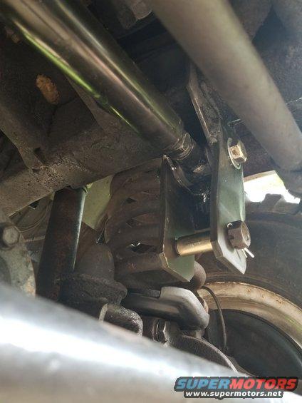 20190608_182451.jpg I turned out that this aftermarket adjustable track bar is too long to work in the lower position.  So for now, it's still in the original frame hole, but it's aligned so the steering wheel is straight.