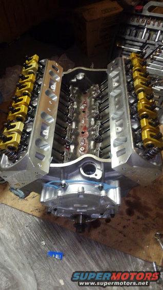 14.jpg valvetrain is done

i am using JimMiller PA rocker arms that are 7/16 stud and 1.6 ratio. these required longer rocker studs and pushrods than normal rocker arms use