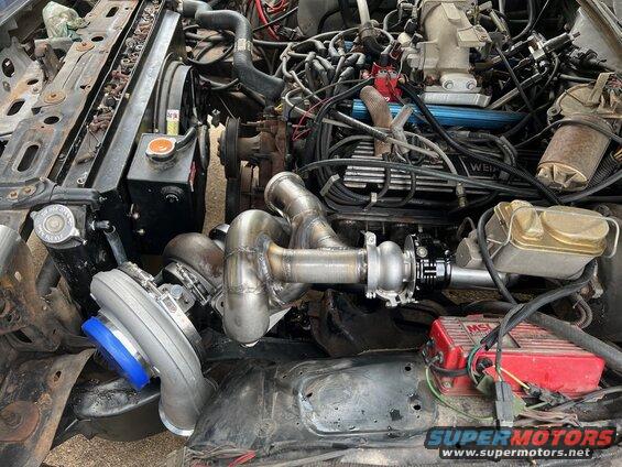 9-header.jpg Installed in the car to check clearances. Looks like the wastegate merge can go under the header. 