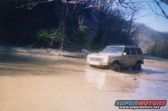 windrock4.jpg Lucus's co-pilot, Daniel, pilots Lucus's Cherokee through standing water on one of the "gravel" access roads