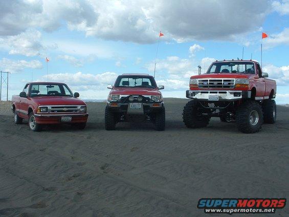 3-red-trucks--moses-4-prefunk.jpg Stock S-10, 4" lift and 33's on the Yota, my truck.