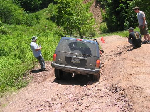 kenjeep.jpg My bud, Ken, in his stock Cherokee with bald tires. He did awesome.