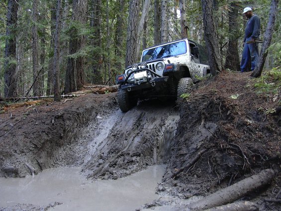 dscn3140.jpg Jeff about to take a slide down a slippery mud hill