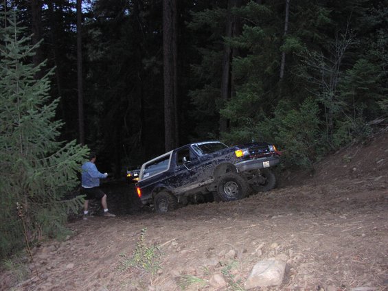 p1010010.jpg Mike trying to get up a 40 degree mud slope on 676.