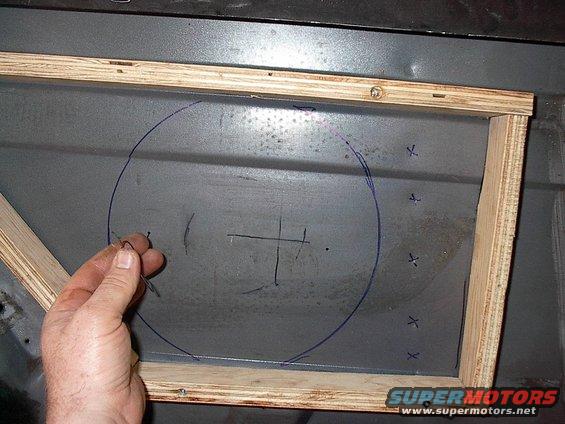 im001952.jpg Here I am using pilot holes and wire to gauge the depth I can recess into the quarter(actually did this right through the vinyl much earlier, to be sure). There's those spot welds again outlined with blue X's.