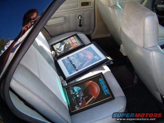 hpim0231.jpg Here is a picture of the back seat with some of the 86 GLHS promotion stuff. One is a April 86 Hot Rod mag cover that shows the 86 GLHS whipping the 65 Shelby Mustang. The other is a Shelby Performance catalog with a 86 GLHS on the cover and the last one is a 86 GLHS brochure with Mr. Shelby's personal signature on it!!!