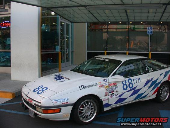 dscn1095.jpg 1990 Ford Probe SCCA Racer in front of Autobacs