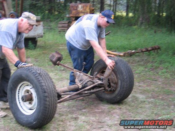 rolling-across-yard.jpg pops & I rolling it to the shop 