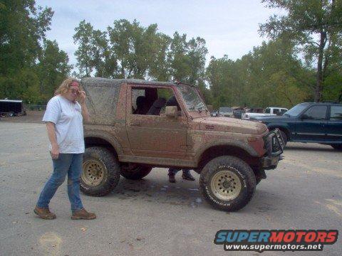 mounds07.jpg Here's me in all my sad glory with the rig that towed me out of the mud hole...sad huh???? Broke the strap 3 times before I got out.