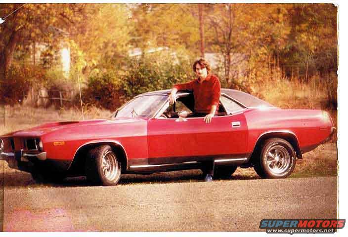 cuda.jpg my highschool 'Cuda
can ya guess the year by the size of the shirt collar? lol