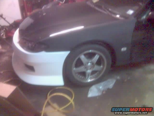 50percentdone.jpg The fenders and hood bolted up; headlights and bumper mocked up.