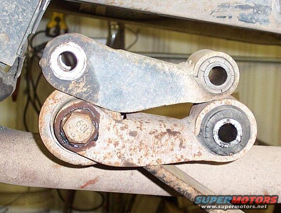 ranger-044.jpg Rear shackles; on top, stock Ranger shackle, below is GM shackle that came with my 63" rear springs.  I used the GM shackle because of the larger bushing and.....