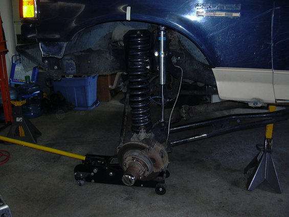 dscn3984.jpg New Bilstein shocks.  My extended brake lines are stretched to the limit.  I also can bottom the shock out with a little pressure.  As the tire is heavy I will need limiting straps.