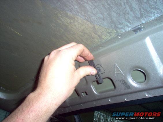 clip-late.jpg The later grab handle screw clips won't fit into the holes pre-punched into my '94 roof.