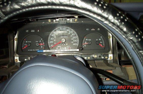 gauge-cluster.jpg Now, the four bolts can be removed and the cluster can be removed. 