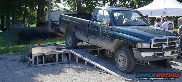 waynedyno.jpg Dyno at TiM 2001.  ITs a little dirty, but the class rules on the show and shine for "work truck" said "fresh from the field."  And it not only went down the drag strip that dirty, but WON.