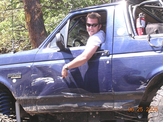 bigsluicedent.jpg Pointing at one of several new dents.  the rocks were wet and slippery.  i actually laid the bronco on its side into a rock (which prevented me from flopping over).  A quick blip of reverse got me out of it without too much damage.