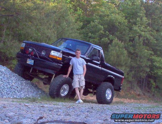 truck-058.jpg HERES ME WITH MY BABY SHOWIN A LITTLE FLEX  ON A PILE OF ROCKS IM ABOUT 6'1" IF IT HELPS SHOW HOW TALL IT ACTUALLY IS