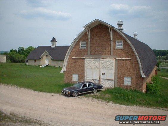 barnnrth.jpg In front of one of the barns of the Traverse City State Hospital.  The barns were built just prior to the Depression.