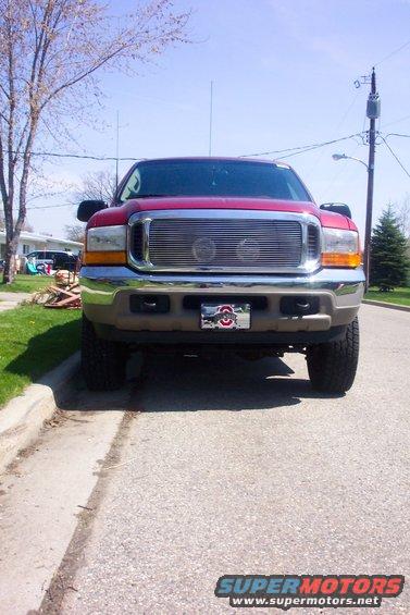 100_3012.jpg The front view of Hella driving lights behind the Still Billet Grill. A nice look that I get great comments on everywhere I go.