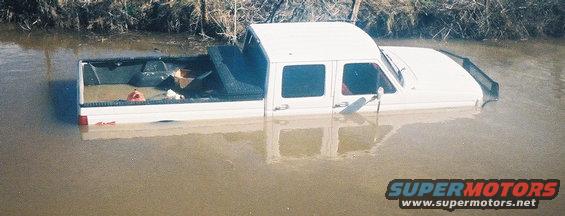 flooded-1.jpg Still wont float...
I had no 4wd, thanks to the trusty auto hubs. Got stuck in hte middle of a river. Sole reason I switched to manual hubs. Truck ran the whole time... water level 1" below air intake.