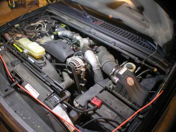 p9290001.jpg Overview of engine compartment before the alternator install (the orange cord is an extension cord ran to the lights I have hanging under the hood of the Excursion).