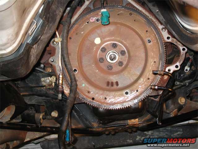 back.jpg The back of my engine. Notice the screwdriver scratches on the flywheel. You have to move that torque conveter somehow. :)