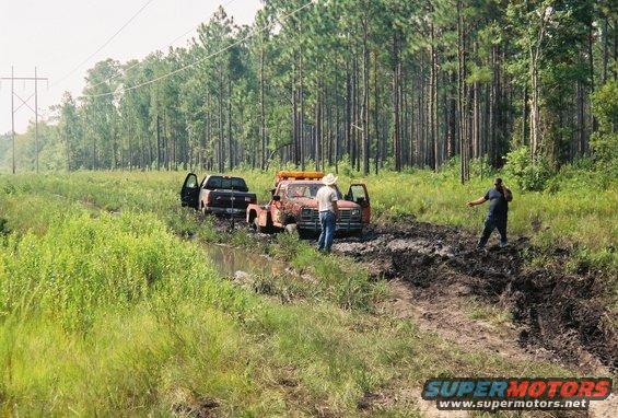 fh000012_edited.jpg right before i snatched the tow truck out.  1 ton ford, worn out 460, 35x15.50 mickey thompsons.  he ran out of gas on the way out of the property, pulled him through 4 small mud holes.  