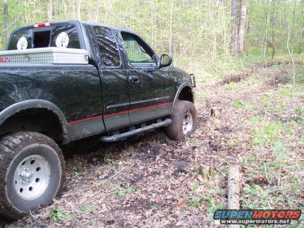 p5090018.jpg Sadly this was the second try. It has a 6 inch lift and 35" tires. Pro Comp X-terrains SUCK! We have since then added a 3 inch body lift and 38" Toyo open country MT's and haven't had this problem. 