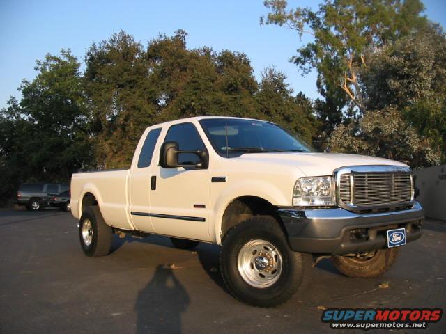 img_0392.jpg THIS IS MY COUSIN 2000 FORD F250XLT 7.3 PSD WUTH 6 SPEED MANUAL TRANS WITH FABTECH 6" LIFT MAGNAFLOW EXHAUST, 35'S ON 16.5'S, 4.11  GEARS, EDGE PROGRAMMER AUTOMETER GAUGES, 12" WOOFERS, WILL BE CHANGING TO A JUICE WITH ATITUDE THIS WEEK FOR ON THE FLY ADJUSTABILITY.