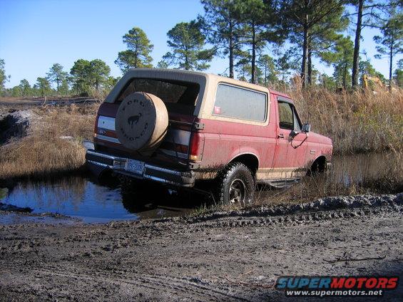 img_1244.jpg If you look real closely you'll see that my suspension is fully extended with my 35" tires completely under water. Under further review both front tires were that way and freely spinning as I sat on my frame. (I had another foot to go before I met the bottom)