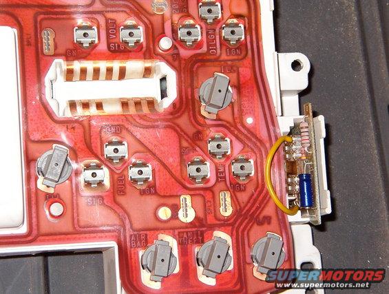 10wire.jpg With its tip tinned & flattened, the wire pushes into the uppermost wiper terminal on the module easily.
IF THE IMAGE IS TOO SMALL, click it.

[url=http://www.supermotors.net/registry/media/760981][img]http://www.supermotors.net/getfile/760981/thumbnail/clusterbezel9296.jpg[/img][/url]

See the PREVious & NEXT several captions...