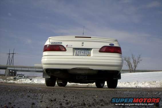 image021.jpg Low rear shot.  "SHO" type spolier, and a great piece broken off the center of my bumper.  (near the bottom.)  I think someone ate it up with a shovel or somethin in teh cold. ger