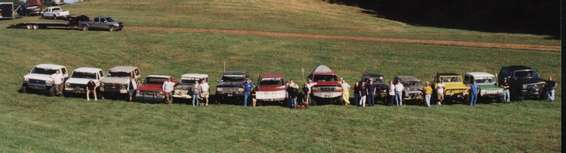 group.jpg Group picture time.  Brad, Carl, Rick, Barry, Adam, myself, Jason, Morris' go-cart daughters, Slim & Steve, Doc, Ronnie, Robert, Morris, Mark.  2 Big Dixie banner is in front of Jason's rig.