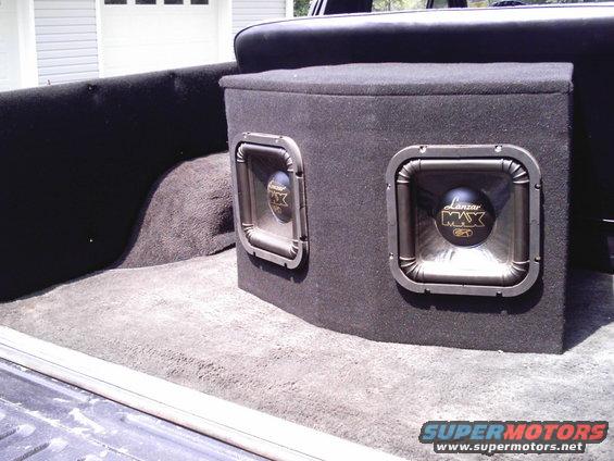 imag0004.jpg $100, 2- 800w lanzar subs mounted in custom box w/ amp resessed in the back.
hits hard with the box being so big.
couldn't afford kickers. 
still can't.