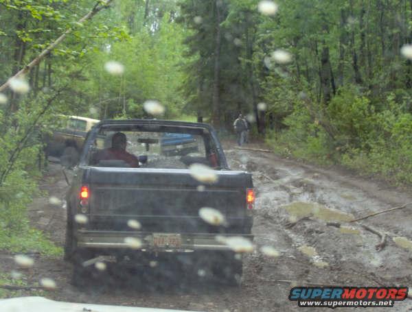 chevystuck.jpg My best pic with the new back bumper, Coming up on chevy with 44's stuck in the same hole adam was.