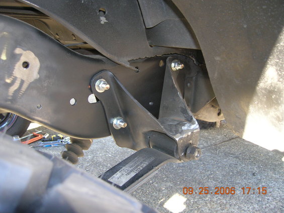 dscn1367.jpg Moved forward hangers back 1 1/4 inches. Improved tire clearance and better shackle angle.