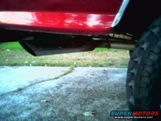 tip.jpg The exhuast flows back from a single in/dual out Flowmaster 40 and exits at a 45* angle in front of the bumper on each side.