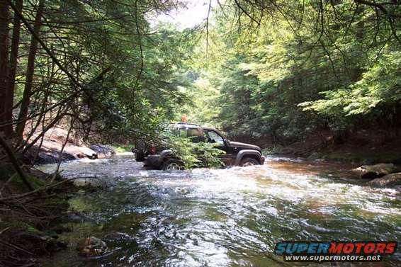 dcp_0177.jpg A neat place to do a water crossing, but with stock street tires, those wet rocks would go through like a hot knife though butter, so we didn't cross.