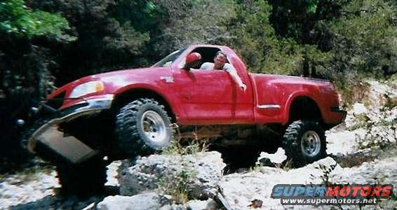 ford_rock.jpg a little rock crawlin, keep in mind, the trucks just about as stock as it gets