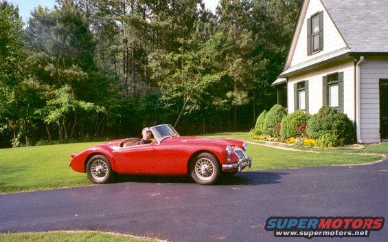 finished1.jpg This is a recent photo, as you can tell by the pavement in the driveway that was gravel during the restoration.  The bonnet is open because the battery was weak.