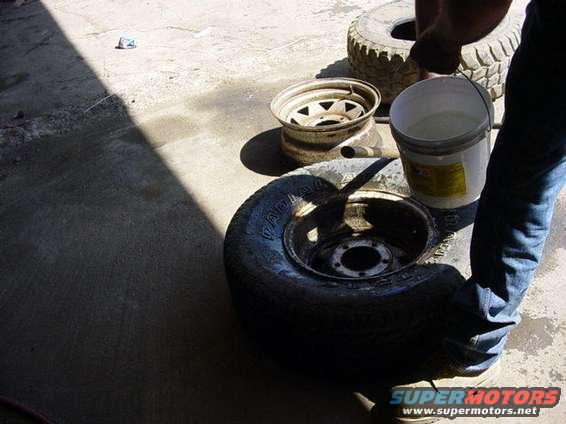 wateronbead.jpg How to remove a tire by hand.  not my tires so i don't care.  it can be hard one them, but they survive.   
First clean the spot where your gonna do this at as best you can, then remove the valve coor, then wet the beads down with water.  soapy water works better.